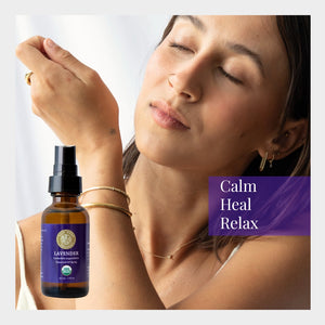Woman applying lavender essential oil spray with a focus on relaxation and wellness.