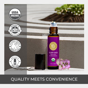 Bottle of Clary Sage essential oil with USDA Organic and Non-GMO labels on a neutral background. quality stainless rollerball amber bottle convenient ethically source