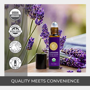 Lavender essential oil bottle with lavender flowers and certification logos on a wooden surface. high quality roller product pure lovely fragrance floral aroma amber glass bottle best brand