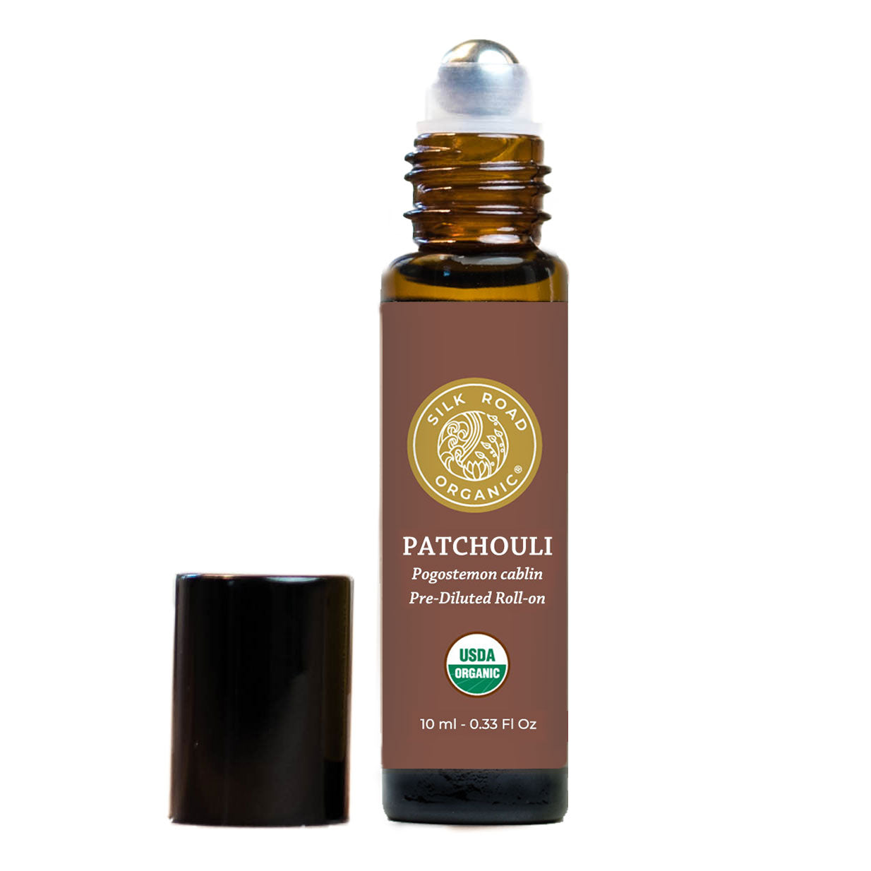 Roll-on bottle of patchouli essential oil with a brown label on a white background. patchouli essential oil spiced earthy woody aroma silk road organic