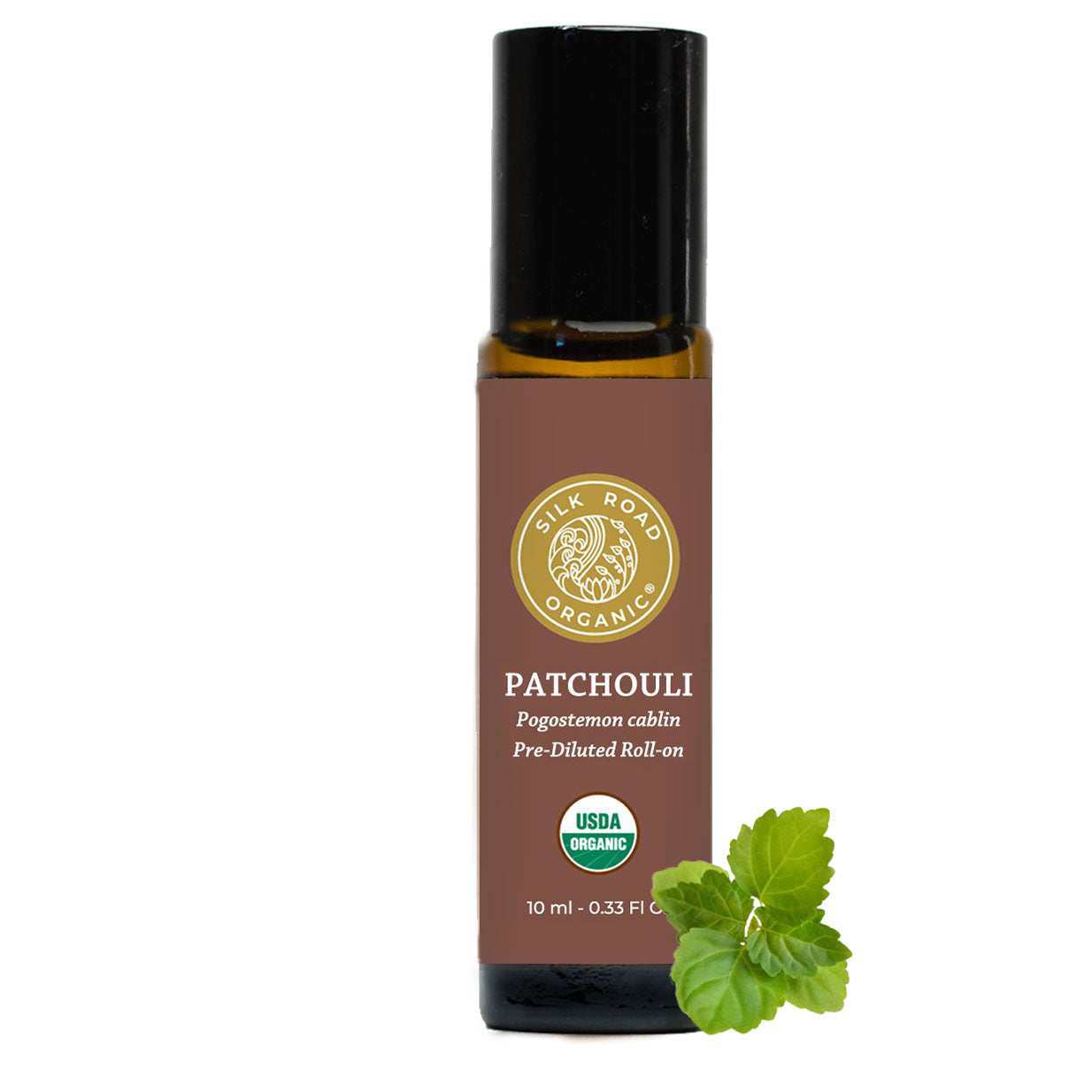 Roll-on bottle of patchouli oil with a green leaf on a white background. patchouli leaf botanical plant Pogostermon cablin perfume fragrance