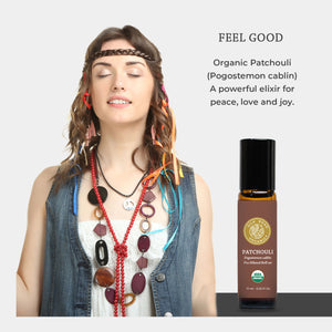 Woman wearing colorful necklaces with a bottle of Patchouli essential oil on a light gray background. hippie peace love joy positivity bliss rejuvenating