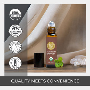 Patchouli essential oil bottle with USDA Organic and Non-GMO labels on a neutral background. luxury premium quality crafted pure ingredient amber glass roller bottle