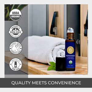 Peppermint essential oil bottle with labels indicating organic, non-GMO, and cruelty-free qualities on a wooden surface. high quality strongest 100 pure roll on size fits backpack purse amber glass bottle spillproof