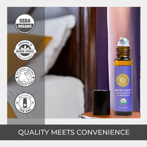Roll-on bottle with purple label on a bedside table, surrounded by certification logos. pure quality santalum album amber glass bottle rollerball usda certified