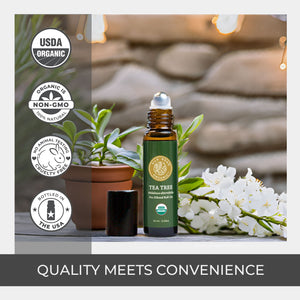 Tea tree oil bottle with organic and non-GMO labels on a blurred natural background pure quality rollerball dark amber glass bottle best purchase usda certified vegan
